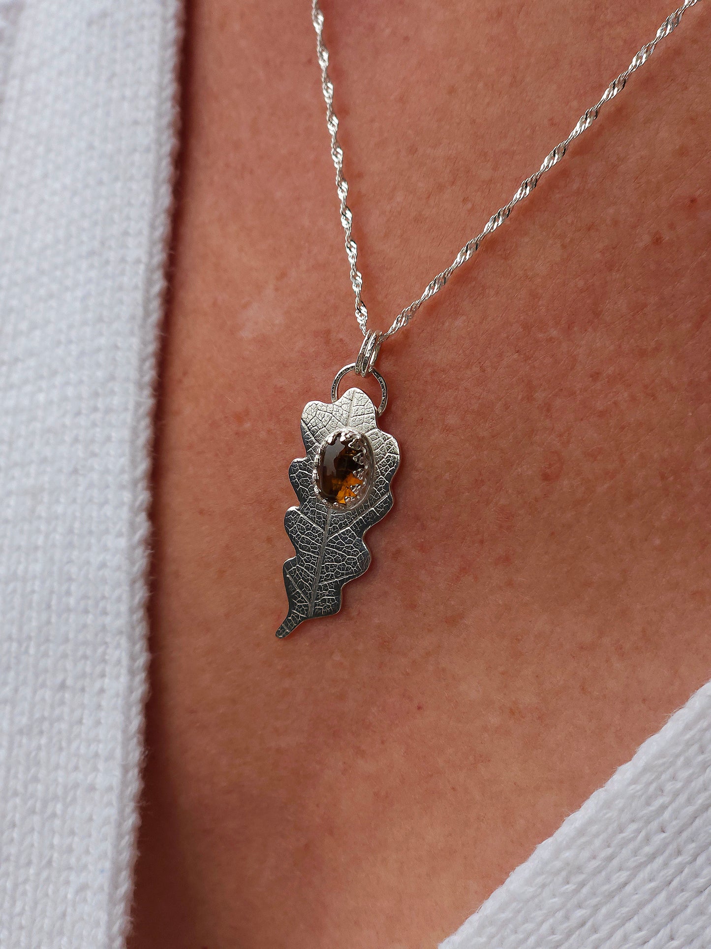 A brown tourmaline leaf necklace in sterling silver.
