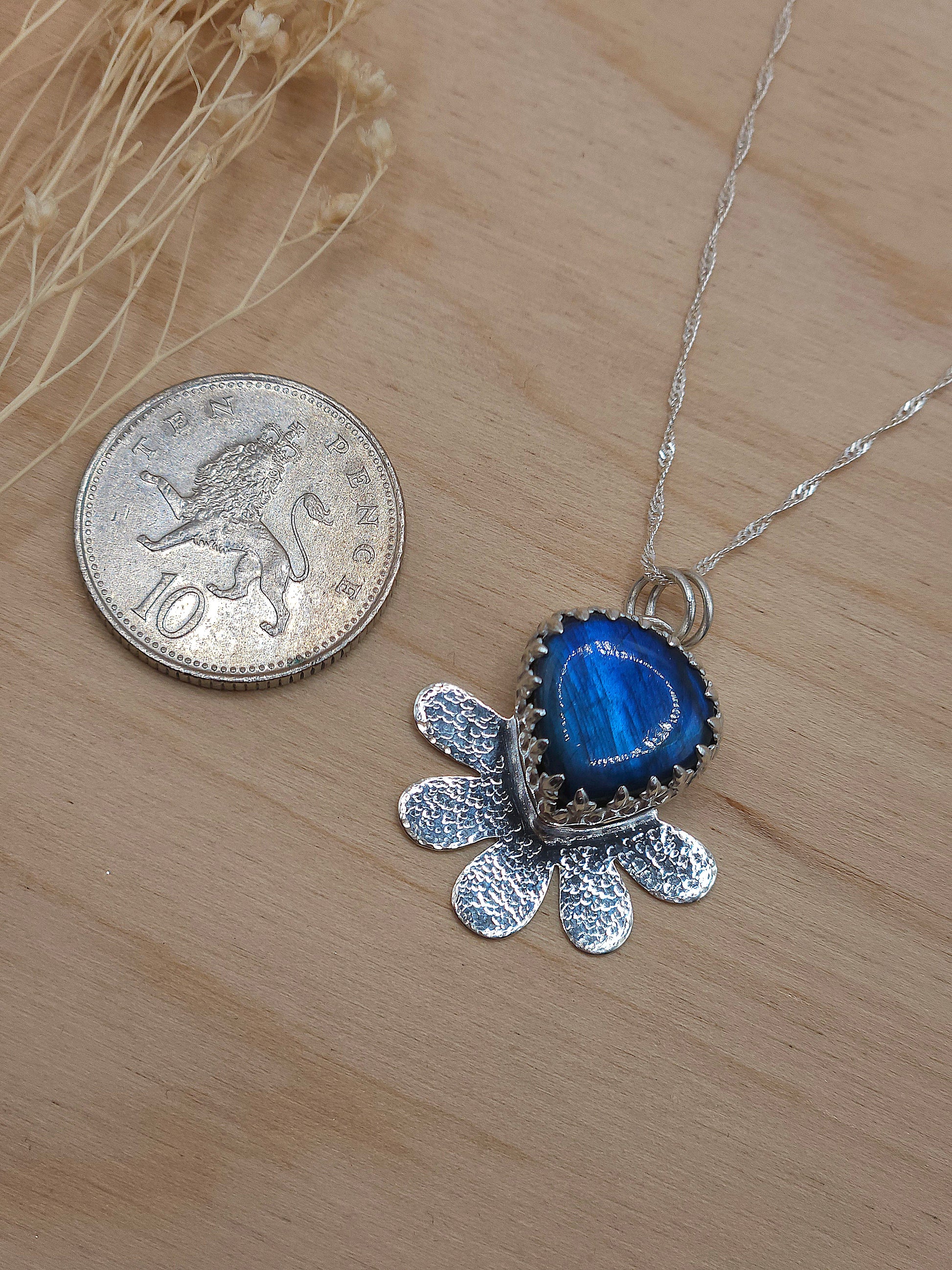 A size reference for the blue Labradorite flower necklace. Roughly the same size as a 10 pence coin.