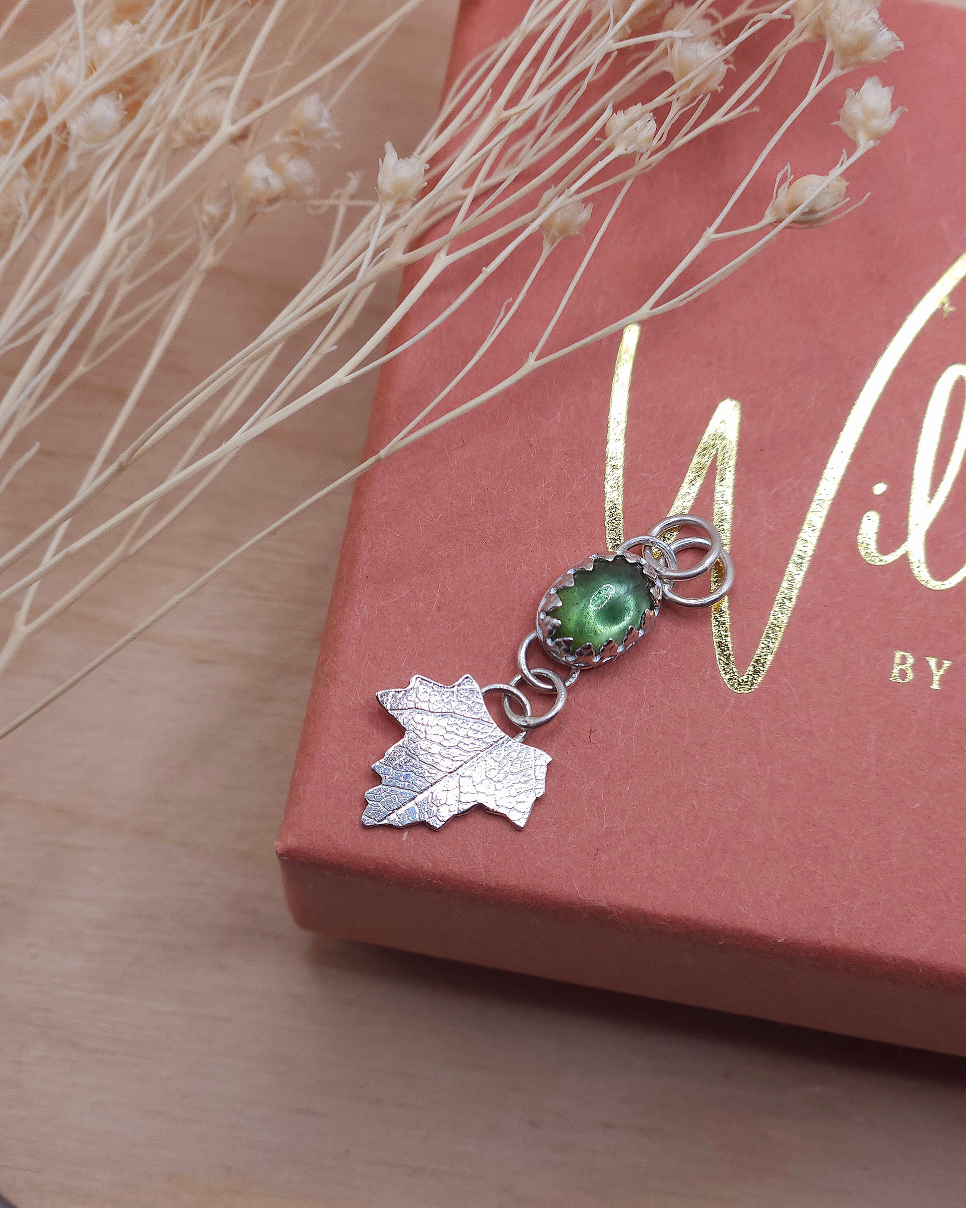 A view from above the green tourmaline leaf drop necklace.