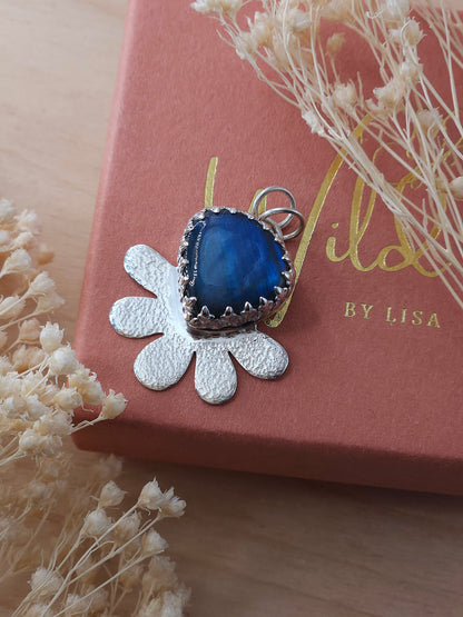 Labradorite gemstone flower pendant placed on Wild by Lisa giftbox.