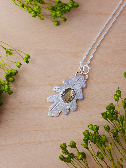 A neutral coloured tourmaline gemstone leaf necklace.
