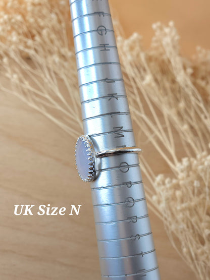 A jewellers ring mandrel holding a sterling silver gemstone ring, showing it is a UK size N.